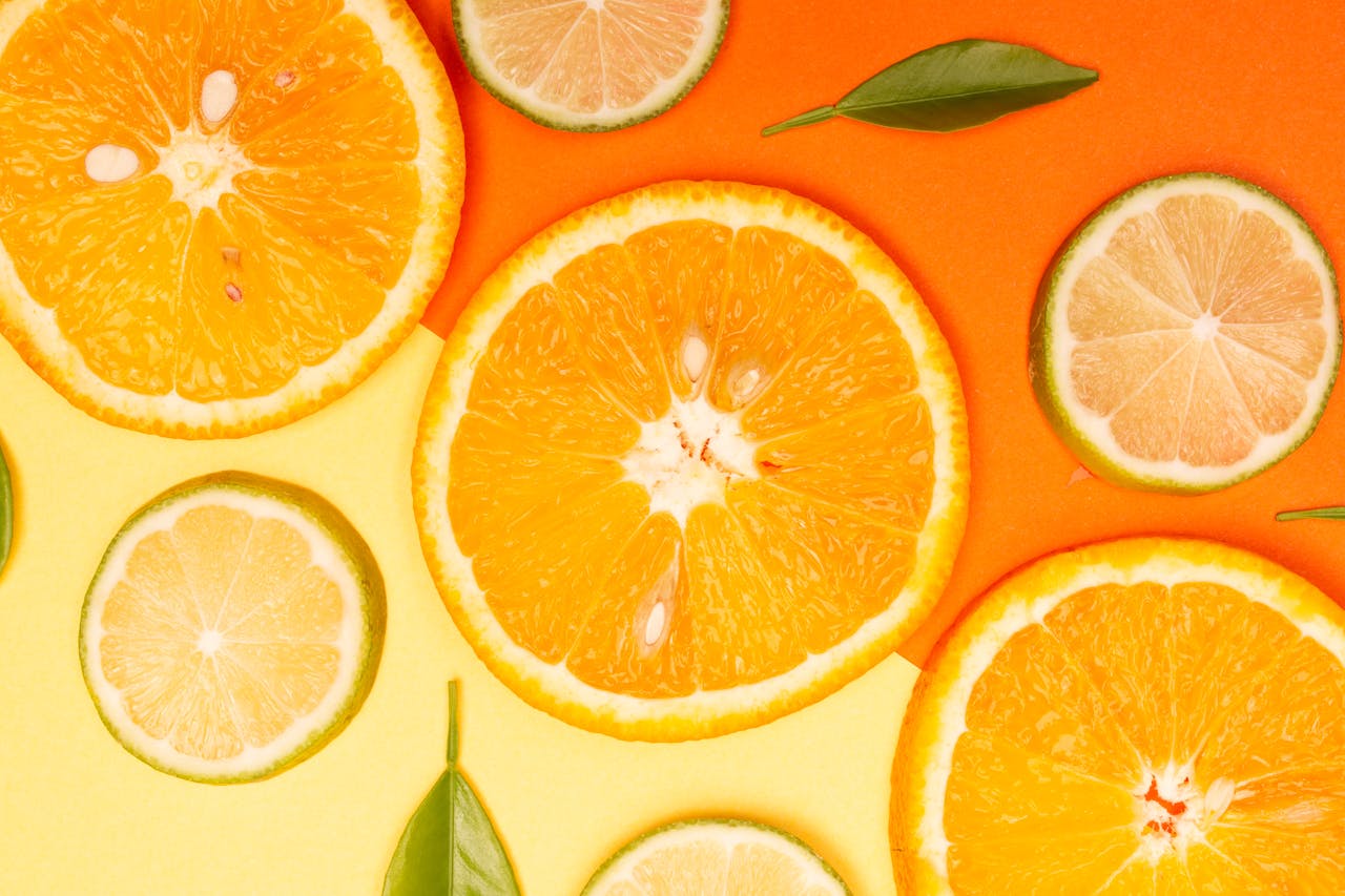 Bright citrus slices and green leaves create a vibrant and fresh composition.